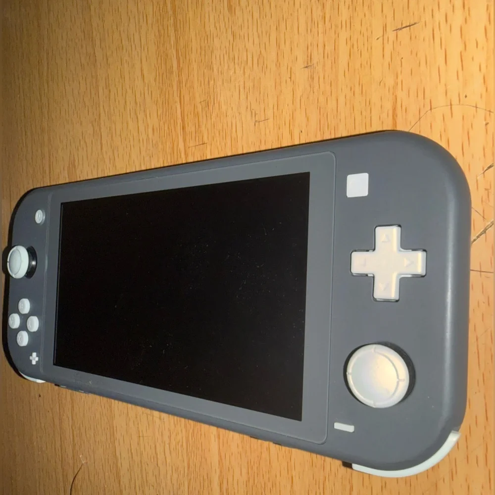 Nintendo Switch Lite Black Handheld Console with Black Charger and Case